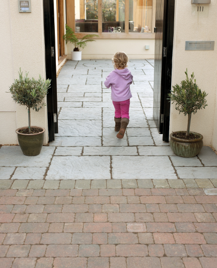 Child running on patio